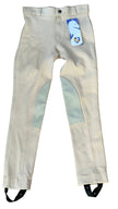 Beige riding pants with gray patches on a wooden floor, featuring a brand tag.