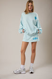 women embroidered seashell sweatshirt blue casual coastal wear



