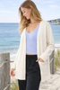 women cream midi open front cardigan with pockets everyday layering front view