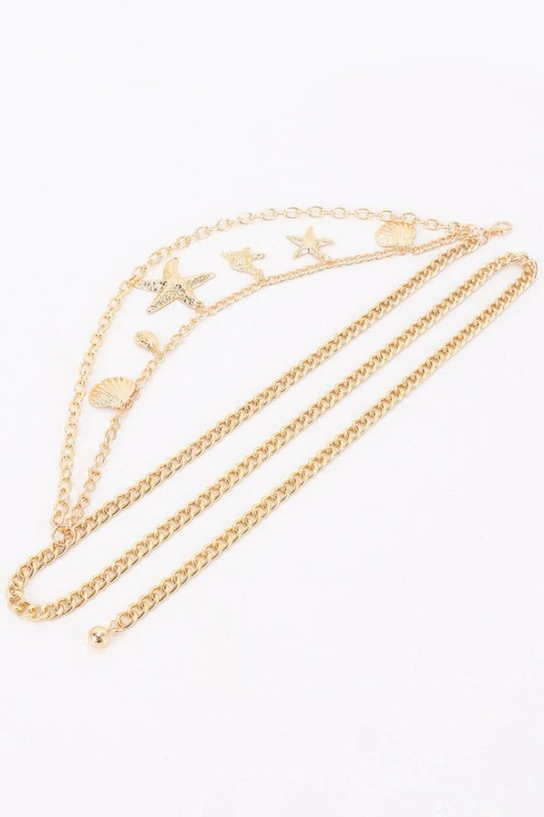 women resort wear belt gold layered waist chain styled outfit


