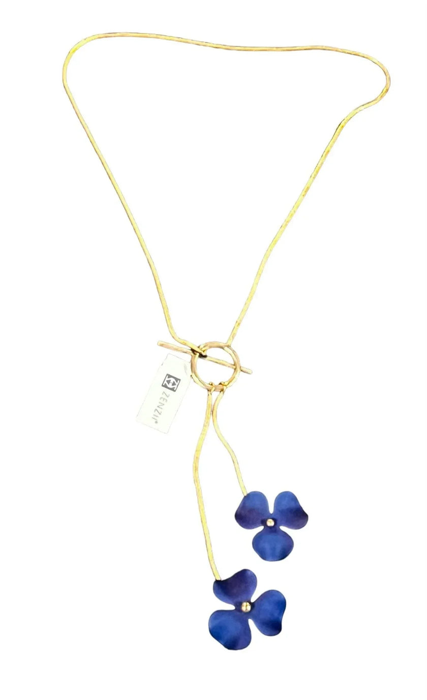 Gold necklace with blue flower pendants on a white background