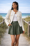 women olive green pleated faux leather mini skirt front view