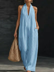 women blue wide leg jumpsuit sleeveless coastal vacation outfit front view

