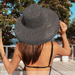 women black wide brim beach hat coastal sun hat vacation outfit front view

