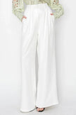 woman white resort wear wide leg pants coastal outfit

