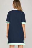 women preppy navy shift dress green trim resort wear outfit close up back view