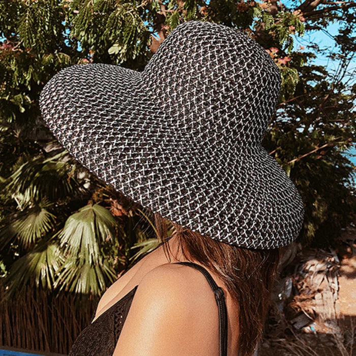 women black sun hat oversized brim beachwear resort style side view
