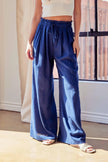 women navy linen palazzo vacation pants styled for tropical resort setting